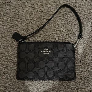 Coach change purse in perfect condition. Black interior with 2 pockets.
